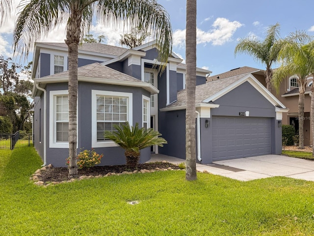 2806 Balforn Tower Way, Winter Garden, FL 34787 - traditional home featuring a garage, a front yard, roof with shingles, stucco siding, and concrete driveway