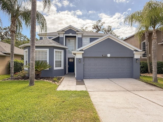 2806 Balforn Tower Way, Winter Garden, FL 34787 - traditional home featuring a garage, driveway, a front lawn, and stucco siding