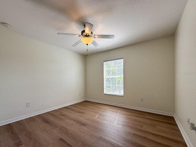 2806 Balforn Tower Way, Winter Garden, FL 34787 - empty room with a smoke detector, wood finished floors, ceiling fan, and a textured ceiling