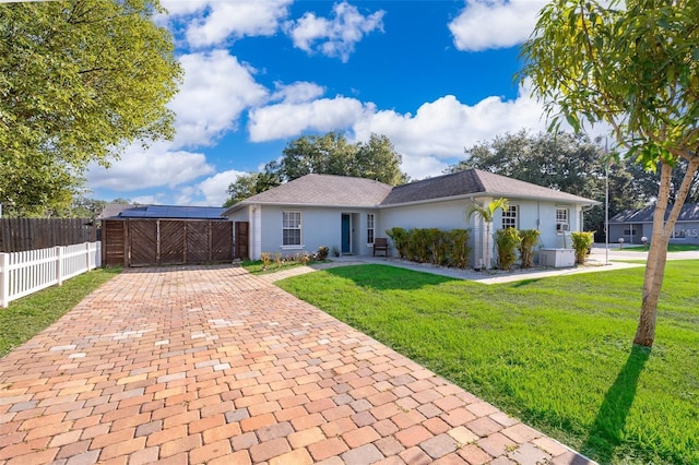 single story home featuring a front lawn