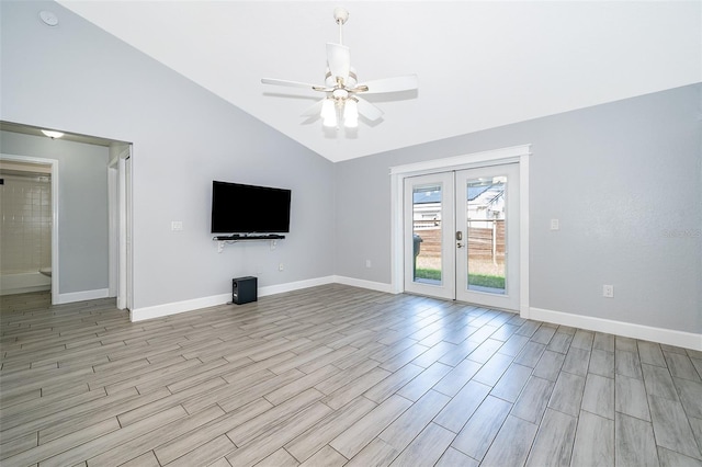 unfurnished living room featuring french doors, high vaulted ceiling, and ceiling fan