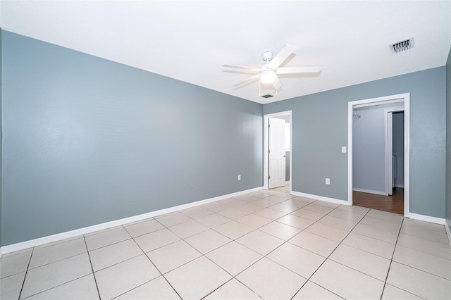 unfurnished bedroom featuring ceiling fan and light tile patterned floors