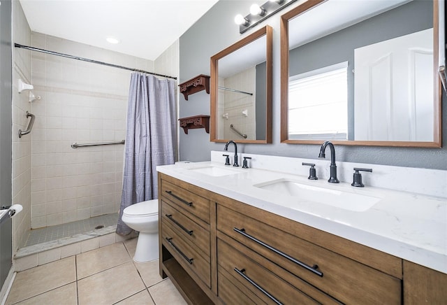 bathroom featuring a shower with shower curtain, vanity, tile patterned floors, and toilet