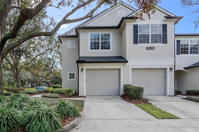 multi unit property featuring a garage