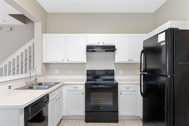 kitchen with white cabinets, sink, light tile patterned flooring, and black appliances