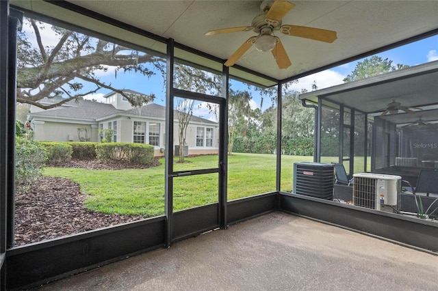 unfurnished sunroom featuring a wealth of natural light and ceiling fan