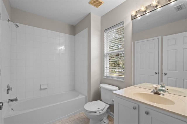 full bathroom featuring tile patterned floors, a wealth of natural light, shower / bathtub combination, and toilet