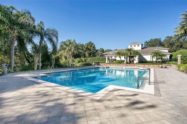 view of swimming pool with a patio area