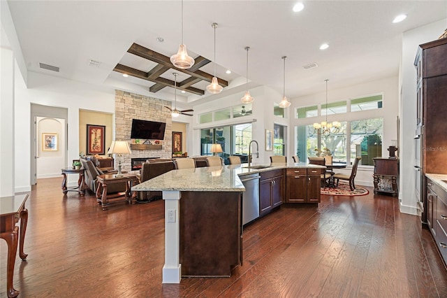 kitchen featuring coffered ceiling, visible vents, dark wood-type flooring, and stainless steel dishwasher