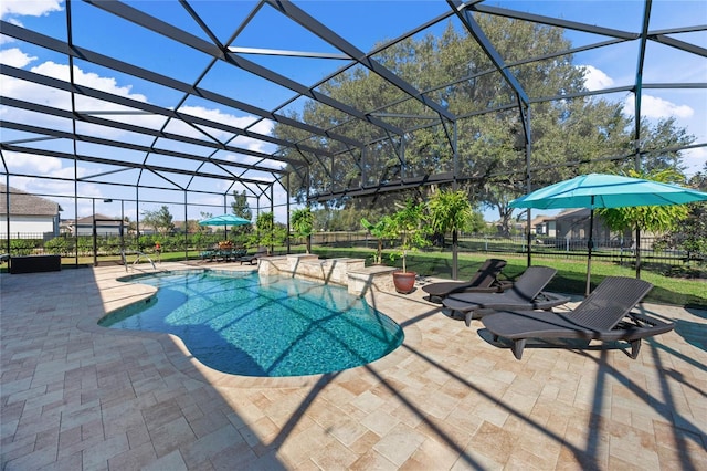 view of pool with a lanai, a patio area, fence, and a fenced in pool