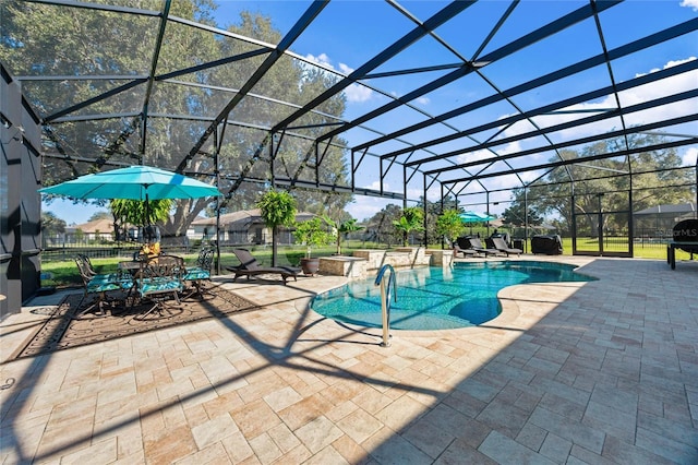 pool with a patio area and a lanai