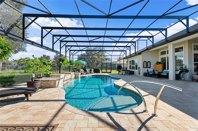 pool featuring glass enclosure and a patio area