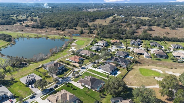 drone / aerial view with a water view and a residential view