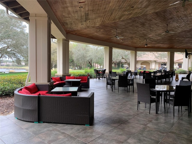 view of patio / terrace with ceiling fan, an outdoor living space, and outdoor dining space