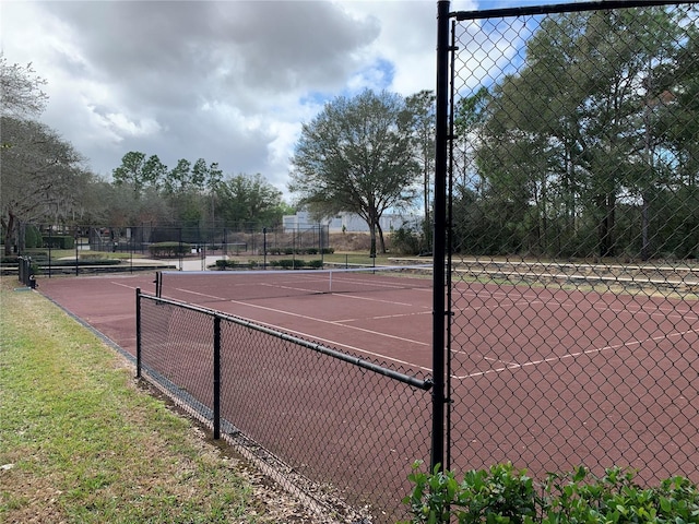 view of tennis court with fence