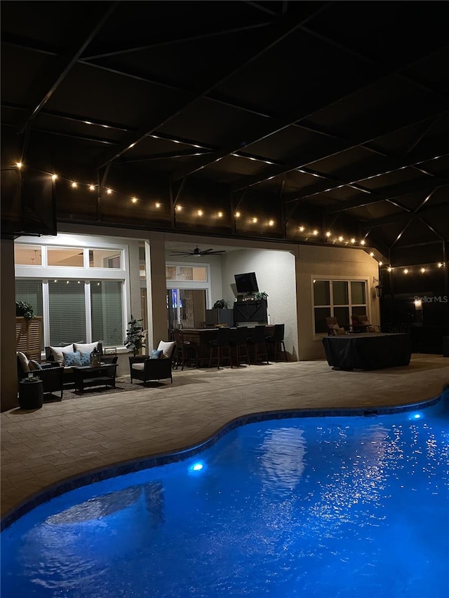 outdoor pool featuring a patio area and an outdoor hangout area