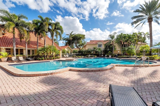 view of swimming pool with a patio area