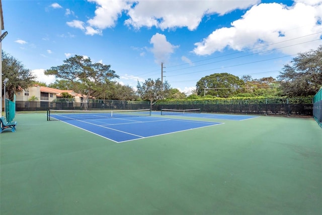 view of sport court with basketball hoop