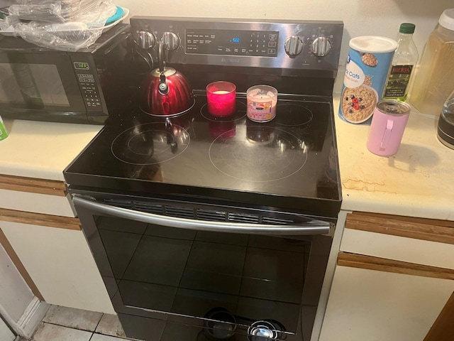 interior details with range with electric cooktop