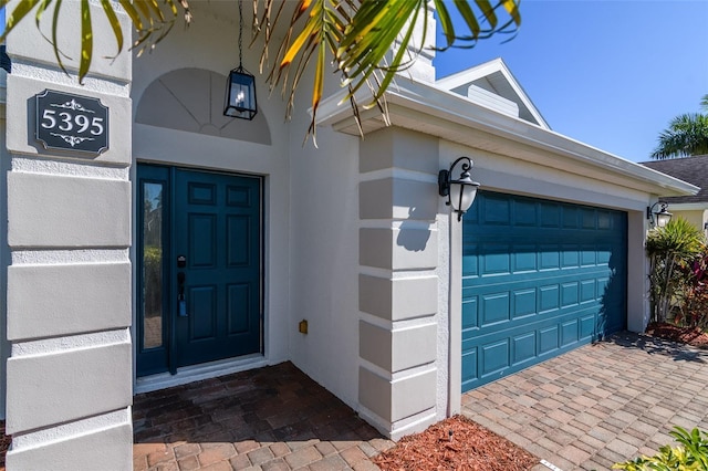 entrance to property featuring a garage