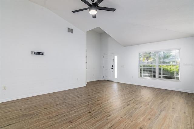 unfurnished living room featuring ceiling fan, high vaulted ceiling, and light hardwood / wood-style flooring