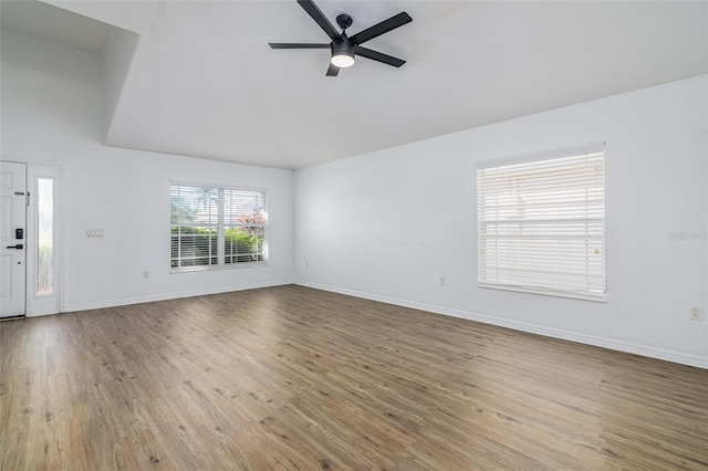 unfurnished living room featuring ceiling fan, high vaulted ceiling, and light hardwood / wood-style floors