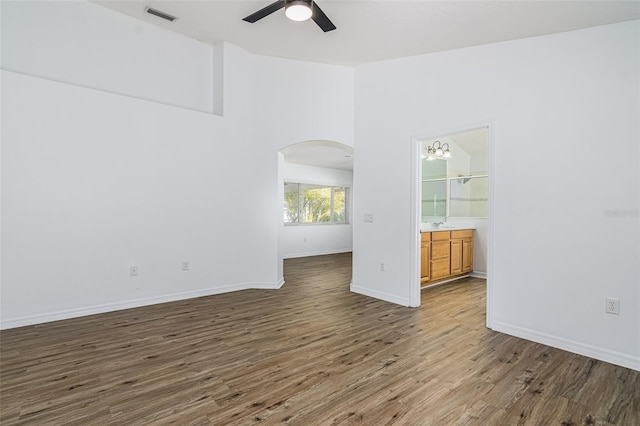 spare room featuring hardwood / wood-style flooring and ceiling fan