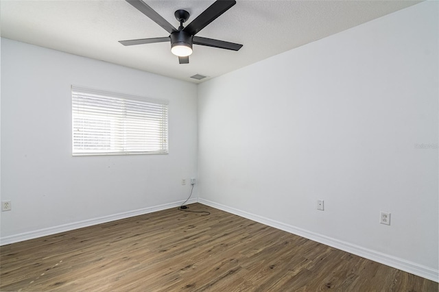 empty room featuring a textured ceiling, wood-type flooring, and ceiling fan