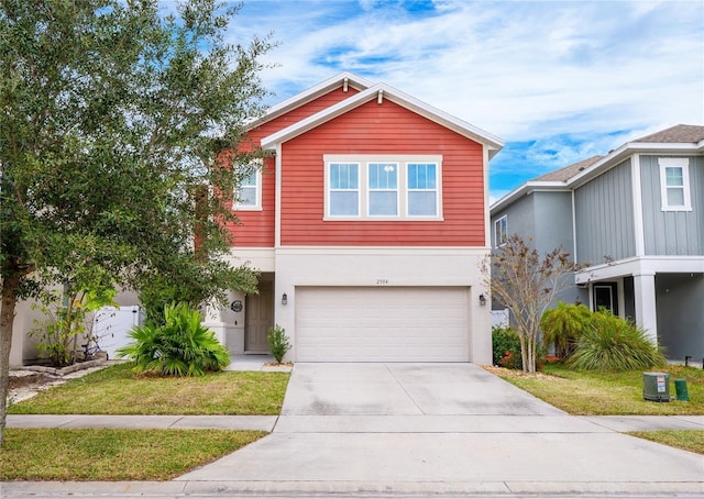 view of front property with a garage and a front lawn