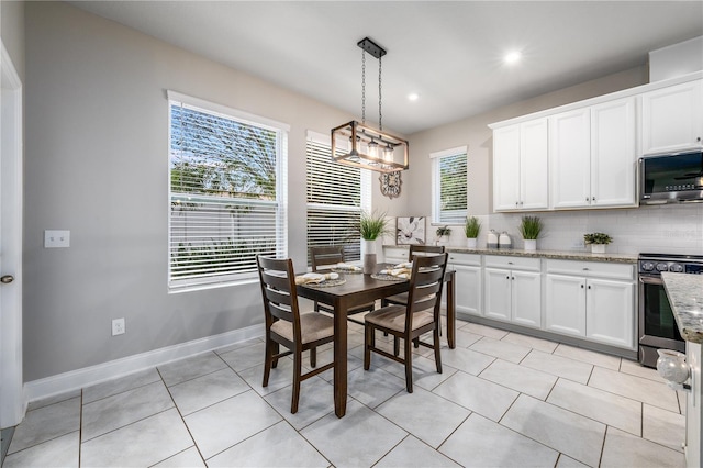 dining area with light tile patterned flooring