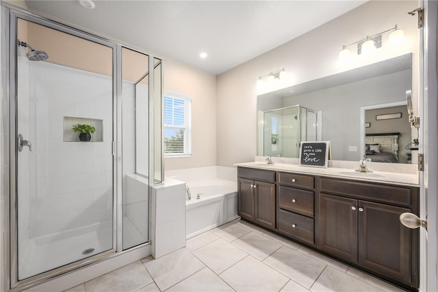 bathroom with tile patterned floors, vanity, and plus walk in shower