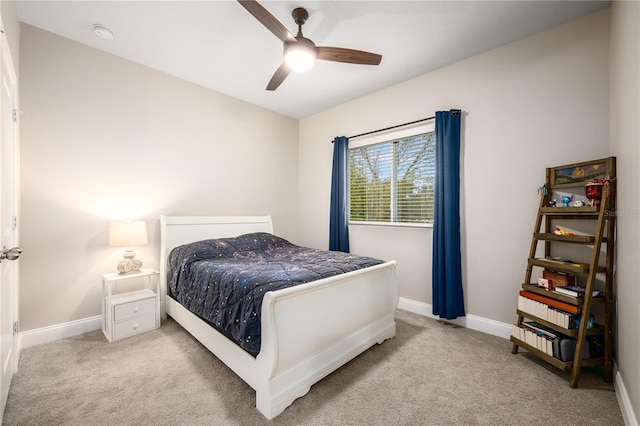 bedroom with light colored carpet and ceiling fan