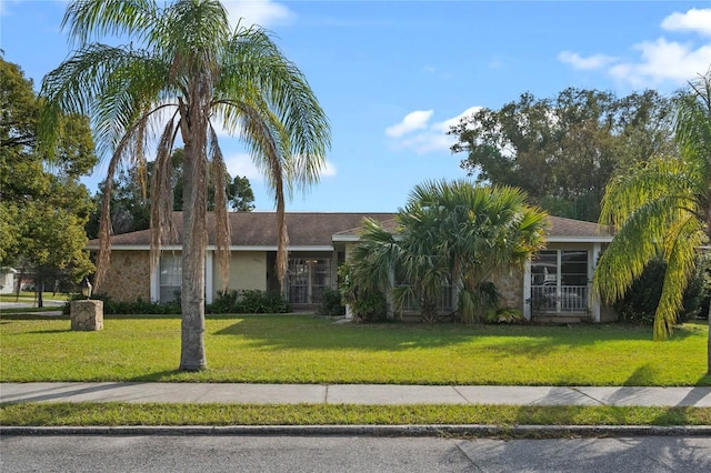 ranch-style house with a front lawn