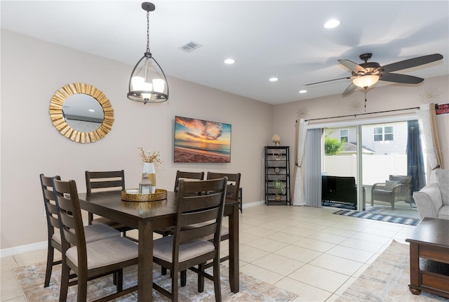 dining area with ceiling fan and light tile patterned floors