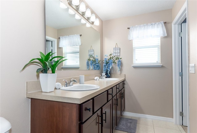 bathroom featuring tile patterned flooring and vanity