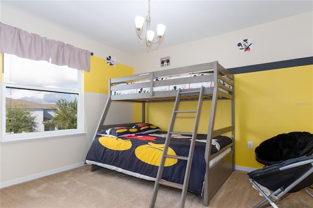 bedroom featuring carpet floors and an inviting chandelier