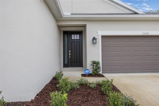 property entrance featuring a garage