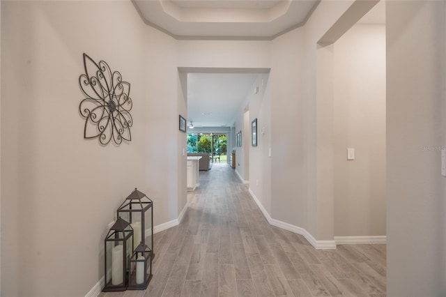 corridor with light wood-type flooring