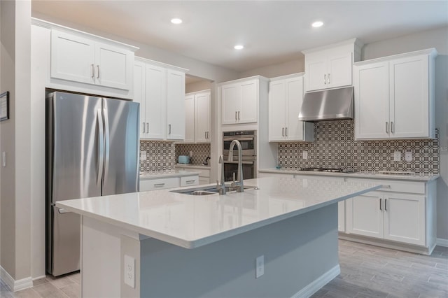 kitchen with white cabinetry and appliances with stainless steel finishes