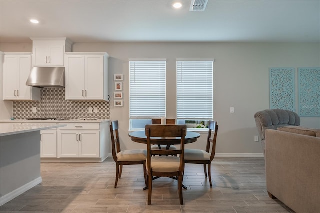 dining area with light hardwood / wood-style floors