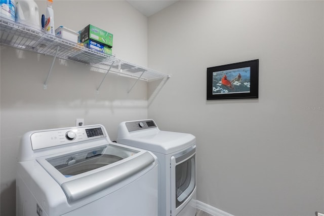 laundry area with washing machine and clothes dryer