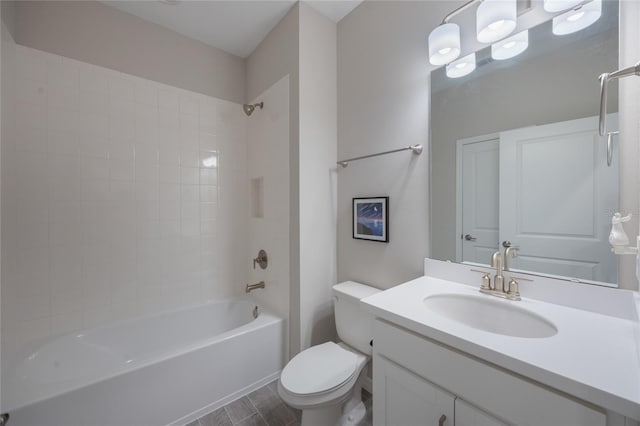 full bathroom featuring washtub / shower combination, vanity, and toilet