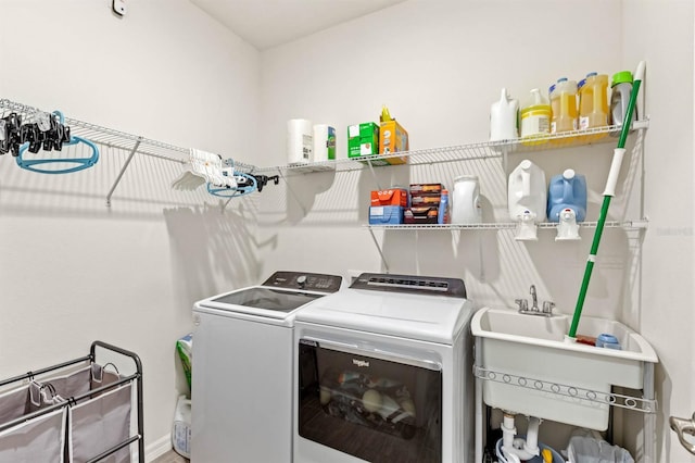 laundry room featuring washer and dryer and sink