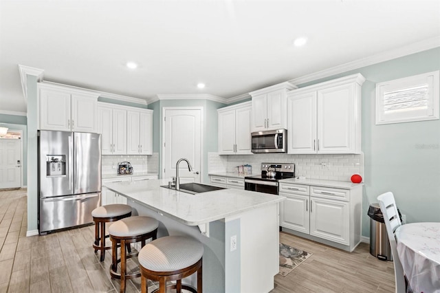 kitchen featuring white cabinetry, sink, and appliances with stainless steel finishes