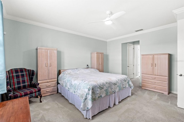 carpeted bedroom featuring ceiling fan and crown molding