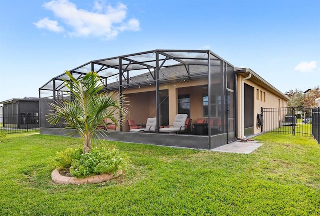 rear view of property featuring glass enclosure and a yard