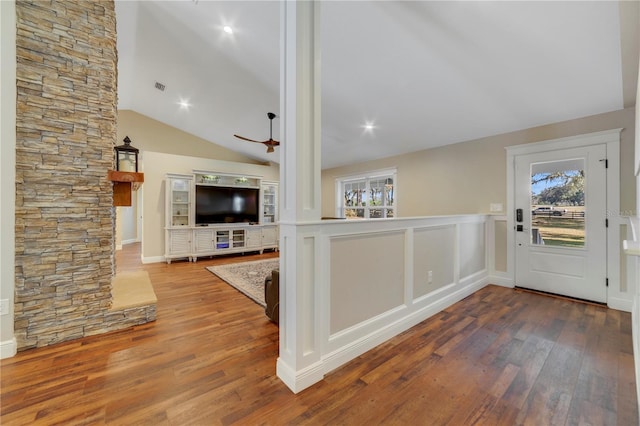 entrance foyer with hardwood / wood-style flooring, a wealth of natural light, lofted ceiling, and ceiling fan