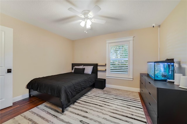 bedroom featuring ceiling fan and light wood-type flooring