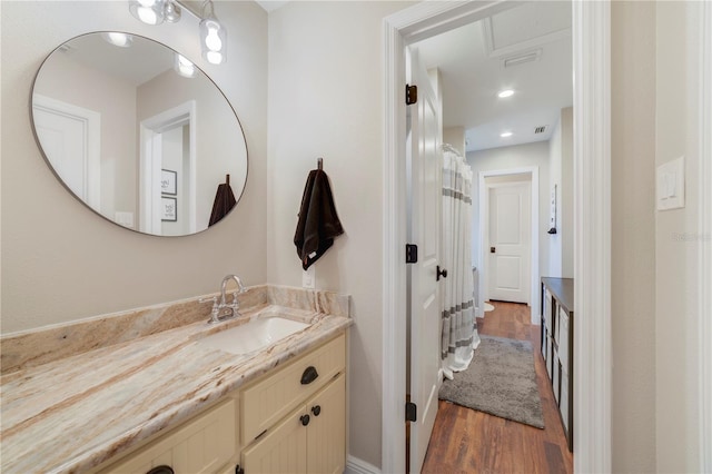 bathroom featuring wood-type flooring and vanity