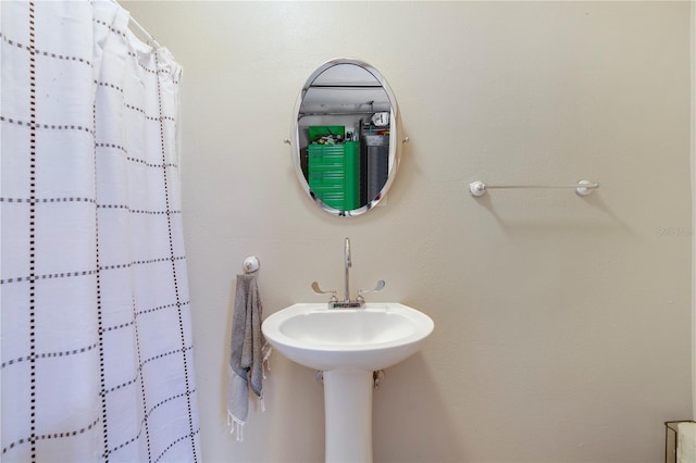 bathroom with a shower with shower curtain